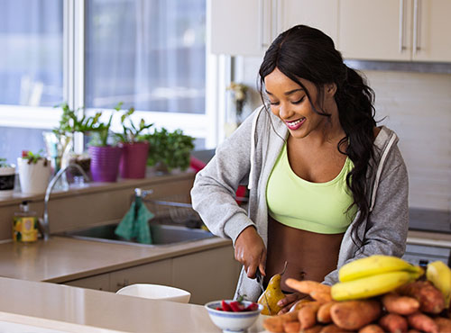 A girl cutting fruits